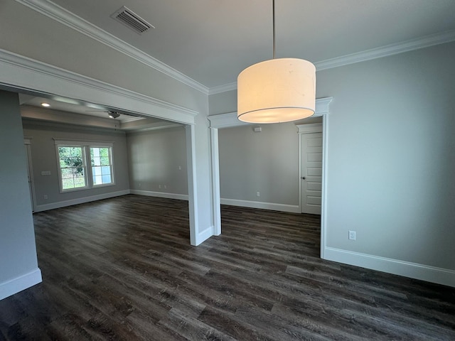 empty room with dark wood-type flooring and crown molding