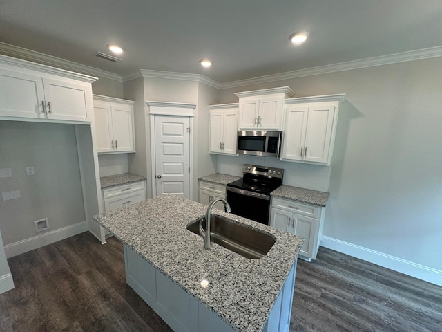 kitchen featuring white cabinetry, appliances with stainless steel finishes, dark hardwood / wood-style floors, and a kitchen island with sink