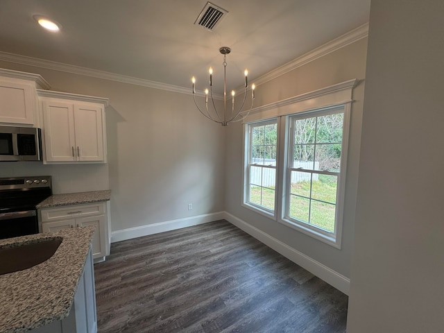 kitchen featuring stainless steel appliances, light stone counters, dark hardwood / wood-style floors, crown molding, and white cabinetry