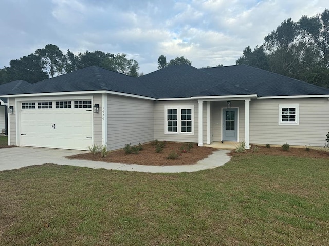 ranch-style home with a garage and a front yard