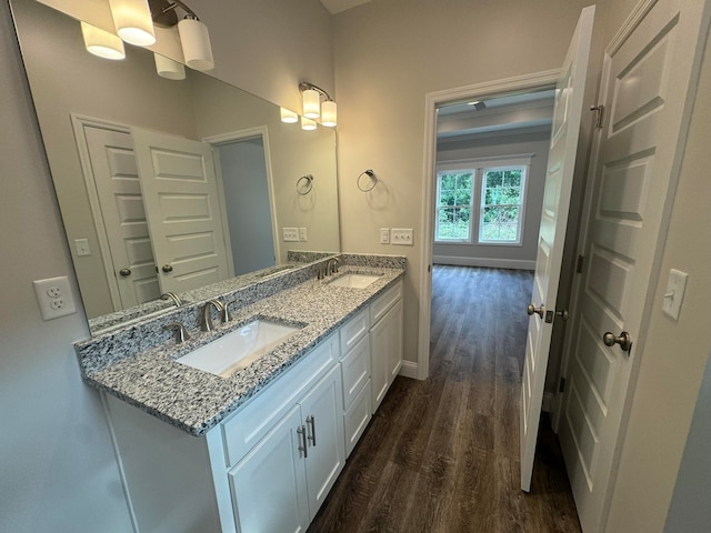 bathroom featuring hardwood / wood-style floors and vanity