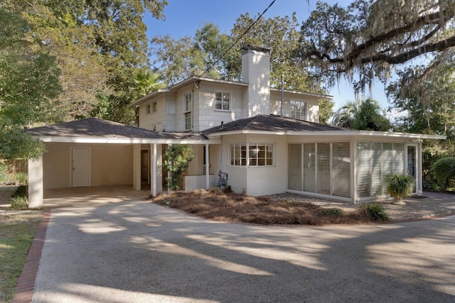 exterior space featuring a carport