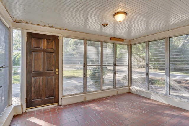 unfurnished sunroom featuring a wealth of natural light