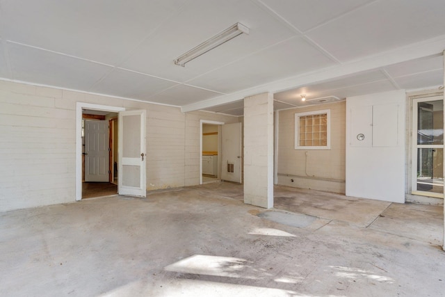 empty room with washer / clothes dryer and concrete floors