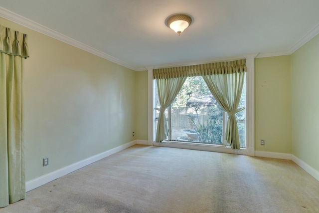 unfurnished room with light carpet and crown molding