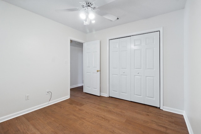 unfurnished bedroom featuring ceiling fan, hardwood / wood-style floors, and a closet