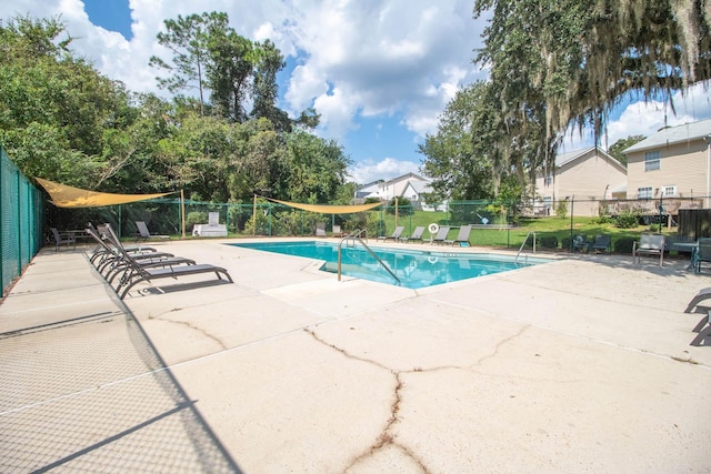 view of pool featuring a patio area