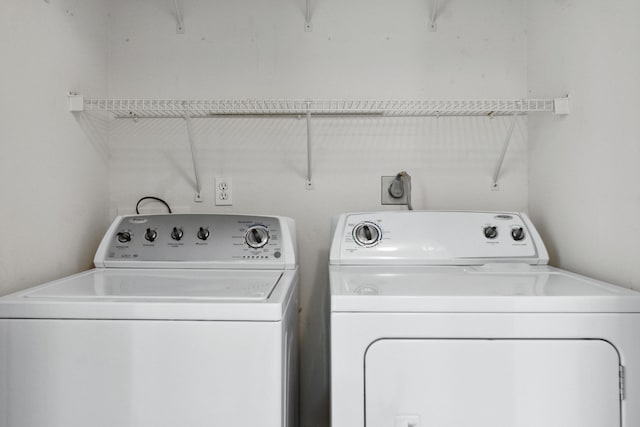 laundry room featuring separate washer and dryer