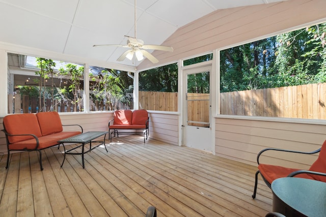 sunroom / solarium featuring lofted ceiling and ceiling fan