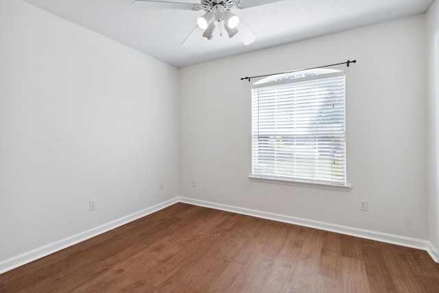 empty room with hardwood / wood-style flooring, a textured ceiling, and ceiling fan