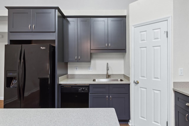 kitchen featuring sink, gray cabinets, and black appliances