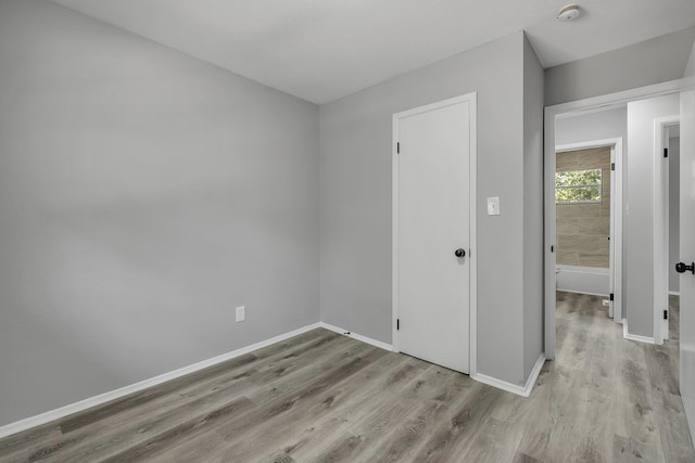 2124 Berkshire Dr, Tallahassee, FL 32304 - unfurnished bedroom featuring wood finished floors and baseboards