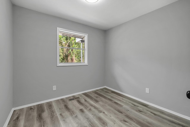 2124 Berkshire Dr, Tallahassee, FL 32304 - empty room featuring wood finished floors and baseboards