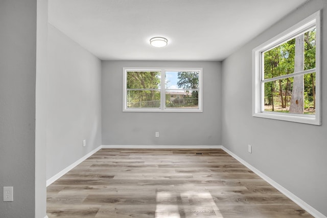 2124 Berkshire Dr, Tallahassee, FL 32304 - empty room featuring wood finished floors and baseboards