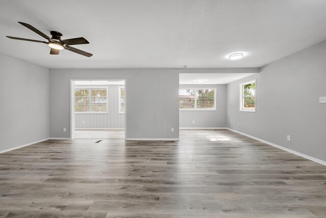 2124 Berkshire Dr, Tallahassee, FL 32304 - spare room featuring baseboards, a ceiling fan, and wood finished floors