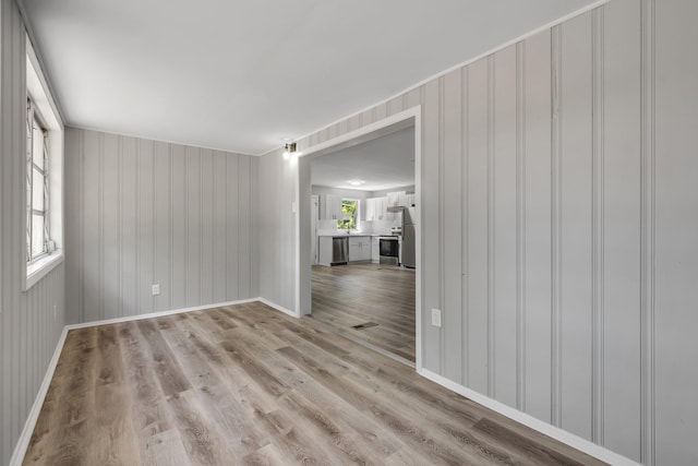 2124 Berkshire Dr, Tallahassee, FL 32304 - empty room featuring baseboards and light wood-type flooring