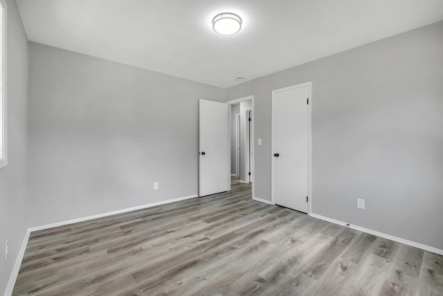 2124 Berkshire Dr, Tallahassee, FL 32304 - empty room featuring wood finished floors and baseboards