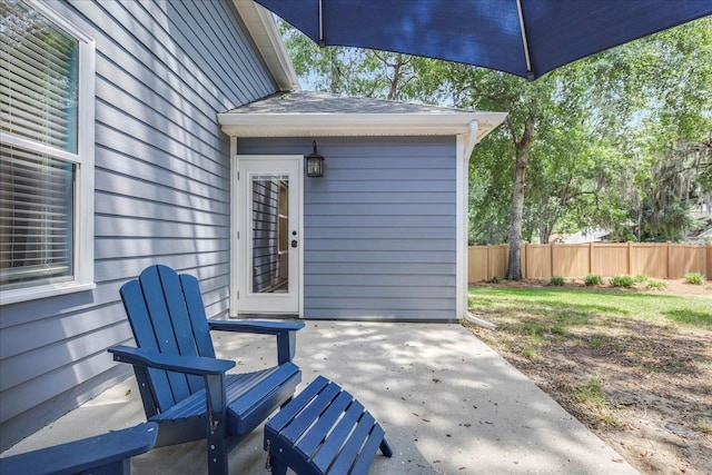 view of patio / terrace featuring fence