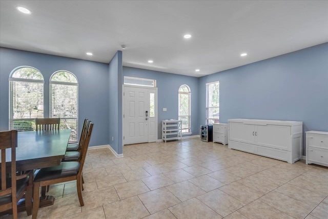 dining room with baseboards and recessed lighting