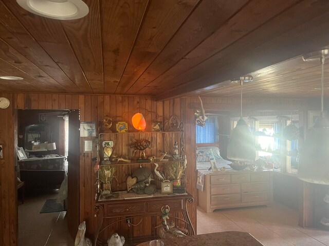 interior space featuring wooden ceiling, wood walls, and light tile patterned floors