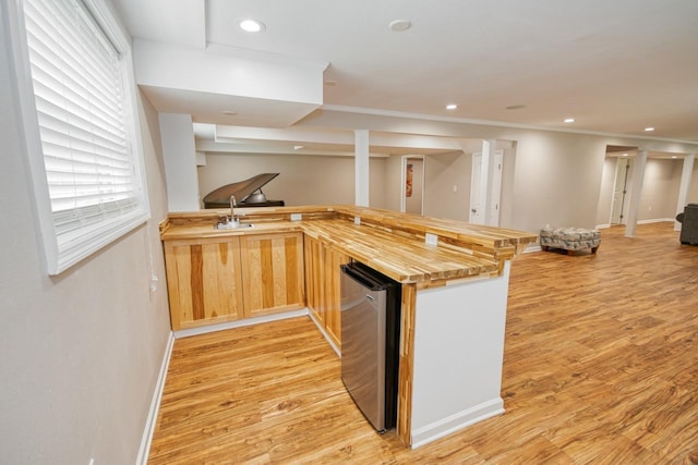 2310 Don Andres Ave, Tallahassee, FL 32304 - kitchen with open floor plan, a peninsula, light wood-type flooring, recessed lighting, and butcher block countertops