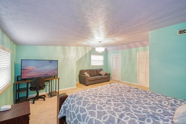 2310 Don Andres Ave, Tallahassee, FL 32304 - bedroom featuring carpet floors, a textured ceiling, baseboards, and two closets