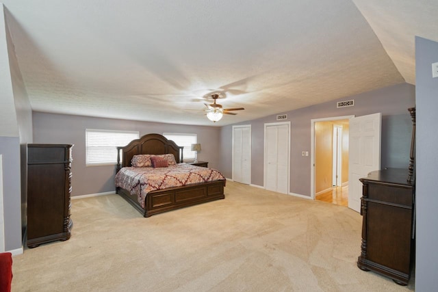 2310 Don Andres Ave, Tallahassee, FL 32304 - bedroom featuring light colored carpet, multiple closets, baseboards, and ceiling fan