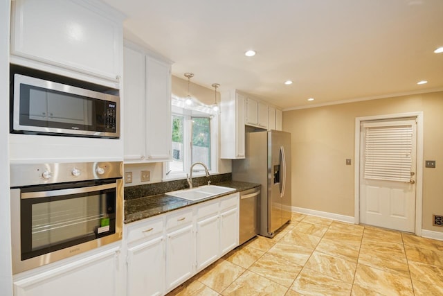 2310 Don Andres Ave, Tallahassee, FL 32304 - kitchen with appliances with stainless steel finishes, a sink, white cabinetry, recessed lighting, and baseboards