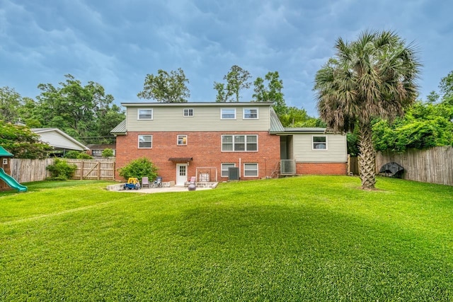 2310 Don Andres Ave, Tallahassee, FL 32304 - back of house featuring a patio, brick siding, and a playground