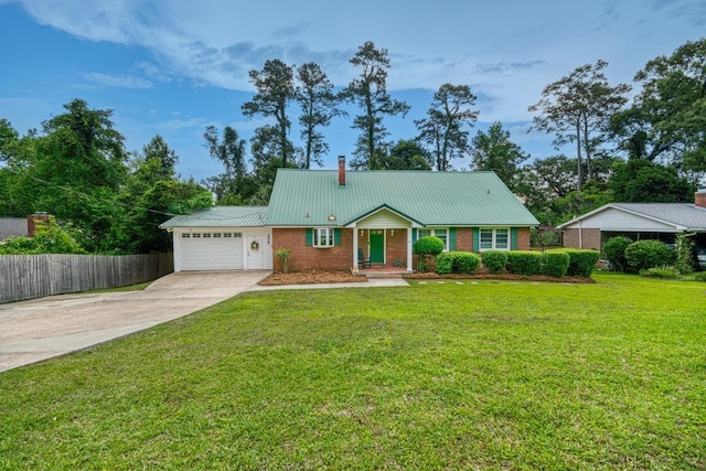 2310 Don Andres Ave, Tallahassee, FL 32304 - view of front of home featuring brick siding, a garage, driveway, metal roof, and a chimney