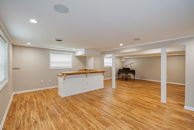 2310 Don Andres Ave, Tallahassee, FL 32304 - below grade area featuring light wood finished floors, baseboards, recessed lighting, and crown molding