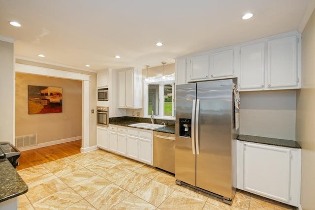 2310 Don Andres Ave, Tallahassee, FL 32304 - kitchen featuring stainless steel appliances, a sink, recessed lighting, white cabinetry, and baseboards
