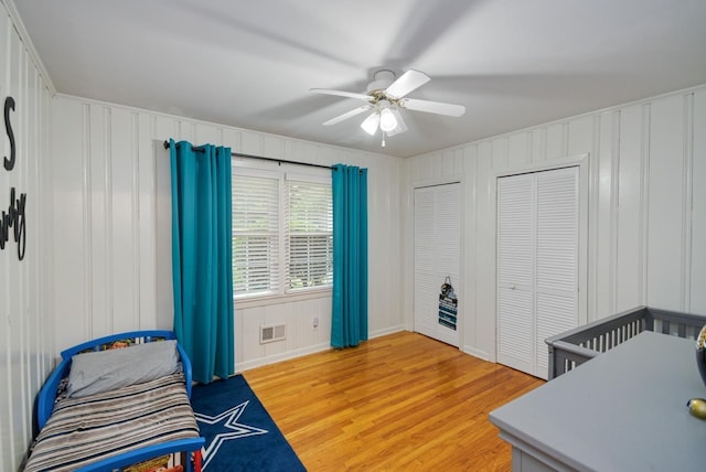 2310 Don Andres Ave, Tallahassee, FL 32304 - bedroom featuring light wood-type flooring, a decorative wall, ceiling fan, and baseboards