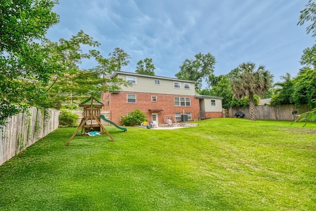 2310 Don Andres Ave, Tallahassee, FL 32304 - back of property featuring a playground, brick siding, and a patio