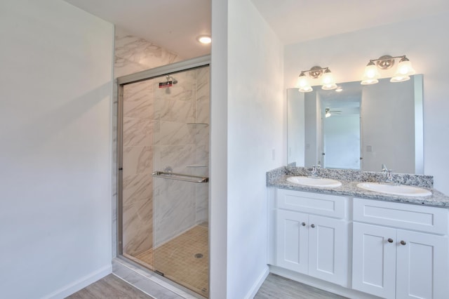70 Tranquility Ln, Havana, FL 32333 - bathroom with double vanity, a stall shower, baseboards, and a ceiling fan