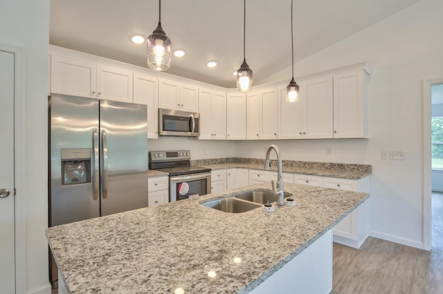 70 Tranquility Ln, Havana, FL 32333 - kitchen with stainless steel appliances, a sink, baseboards, white cabinetry, and vaulted ceiling