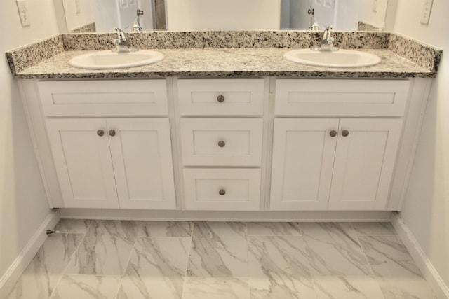 70 Tranquility Ln, Havana, FL 32333 - full bath with marble finish floors, baseboards, and double vanity