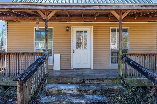 property entrance with covered porch