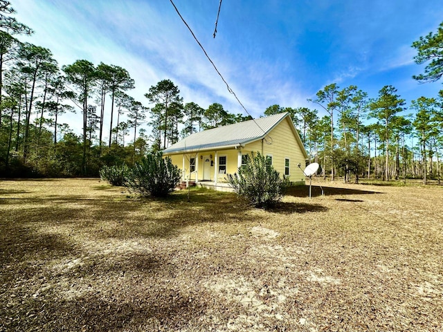 view of side of property with a porch