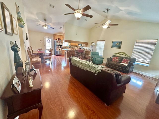 living room with lofted ceiling and hardwood / wood-style floors