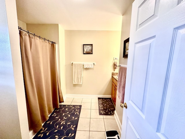 bathroom with tile patterned flooring and vanity