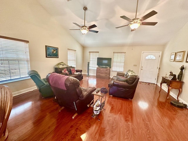 living room with wood-type flooring, high vaulted ceiling, and ceiling fan