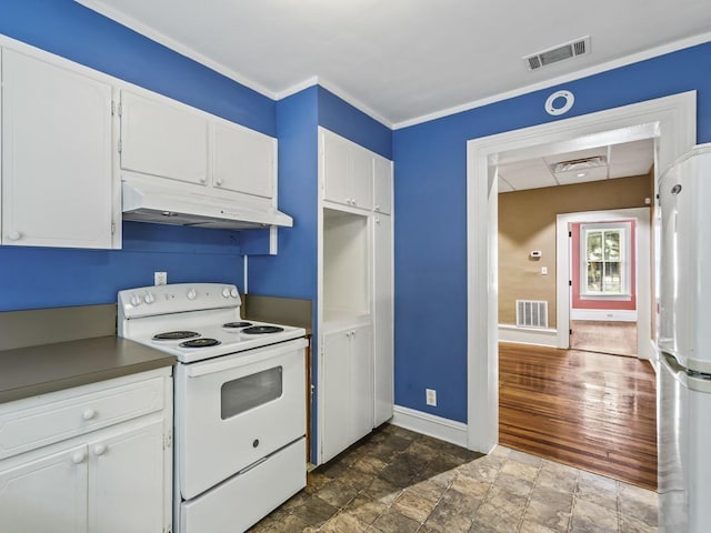 kitchen featuring crown molding, white appliances, and white cabinets