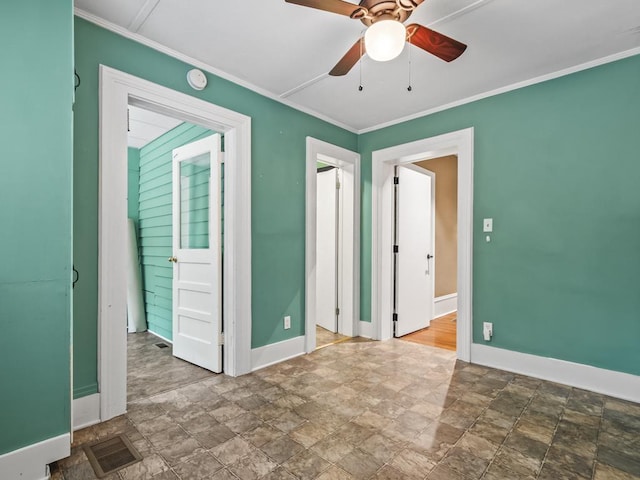 unfurnished room featuring ornamental molding and ceiling fan