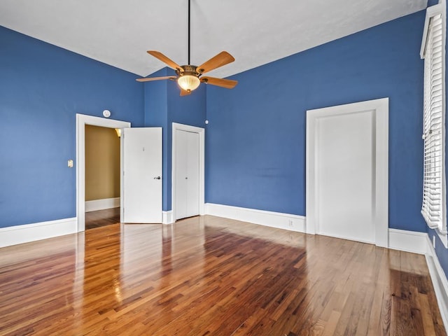 unfurnished bedroom featuring ceiling fan and wood-type flooring