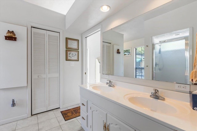 bathroom with vanity, tile patterned flooring, and an enclosed shower