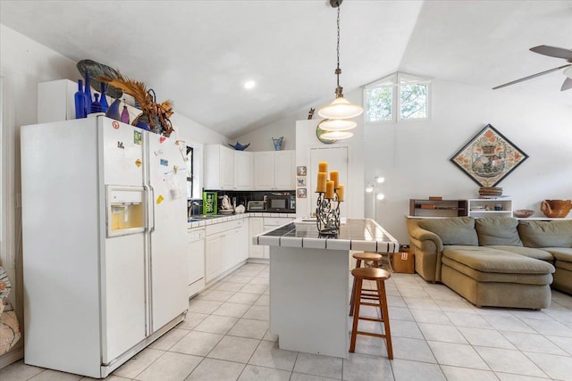 kitchen featuring a kitchen island, white cabinetry, pendant lighting, a breakfast bar, and white appliances