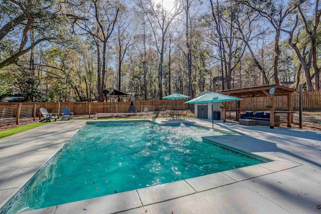 view of swimming pool featuring a fenced in pool, a patio, and a fenced backyard