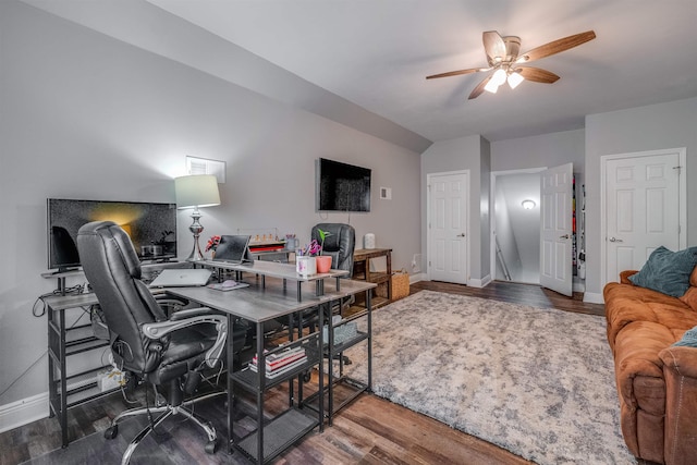 home office with a ceiling fan, wood finished floors, and baseboards