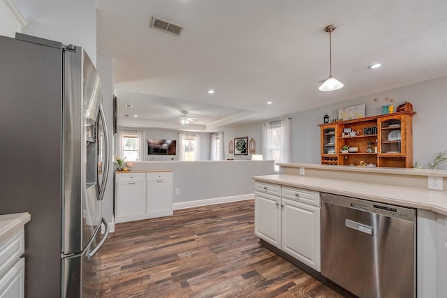 kitchen featuring dark wood finished floors, visible vents, appliances with stainless steel finishes, and white cabinetry